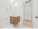 Chic bathroom with a wood vanity, modern lighting, and stylish fixtures at 3008 W Van Buren Dr, Tampa, FL 33611