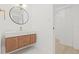 Stylish bathroom with floating vanity, modern fixtures, and ample storage space at 3008 W Van Buren Dr, Tampa, FL 33611