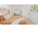 Cozy bedroom with hardwood floors, a woven headboard, soft comforter and neutral decor at 3008 W Van Buren Dr, Tampa, FL 33611