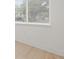 Bright bedroom featuring hardwood floors, white walls, and plenty of natural light at 3008 W Van Buren Dr, Tampa, FL 33611