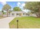 Beautiful home showcasing its well-manicured lawn and quaint curb appeal at 3008 W Van Buren Dr, Tampa, FL 33611
