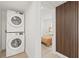 Functional laundry room features stacked washer and dryer units at 3008 W Van Buren Dr, Tampa, FL 33611