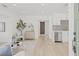 Bright, open-concept living space with light wood floors and modern decor at 3008 W Van Buren Dr, Tampa, FL 33611
