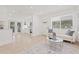 Spacious living area with an open layout and access to the backyard through glass doors at 3008 W Van Buren Dr, Tampa, FL 33611