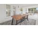 Covered patio area with outdoor dining space and cozy seating area at 3008 W Van Buren Dr, Tampa, FL 33611