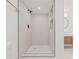 Modern shower features a rainfall shower head, tiled walls, and built-in shelving at 3008 W Van Buren Dr, Tampa, FL 33611