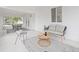 This sunroom has a seating area and dining area with lots of light and views at 3008 W Van Buren Dr, Tampa, FL 33611