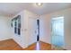 Inviting foyer with wood-look flooring, window, and access to other rooms at 3053 Gregor Ct, Palm Harbor, FL 34684