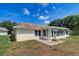 Exterior view of a charming home with a screened-in lanai and a paver patio at 3053 Gregor Ct, Palm Harbor, FL 34684