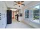 Eat-in kitchen boasts white cabinets, stainless appliances, and views of the backyard at 3053 Gregor Ct, Palm Harbor, FL 34684
