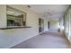 Large open-air lanai with pass-through window to the kitchen, perfect for entertaining at 3053 Gregor Ct, Palm Harbor, FL 34684