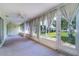 Bright lanai with multiple windows offering views of the backyard at 3053 Gregor Ct, Palm Harbor, FL 34684