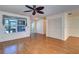 Spacious living area with wood-look flooring, large window, and ample closet space at 3053 Gregor Ct, Palm Harbor, FL 34684