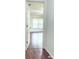 Serene bedroom with hardwood floors and a large window allowing ample natural light at 3095 Coronet Ct, Spring Hill, FL 34609