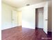 This spacious bedroom features hardwood floors, closet, and convenient hall access at 3095 Coronet Ct, Spring Hill, FL 34609