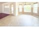 Inviting breakfast nook features large windows for natural light and tile flooring for easy maintenance at 3095 Coronet Ct, Spring Hill, FL 34609