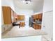 Well-lit kitchen with stainless steel appliances, countertop, and wooden cabinets at 3095 Coronet Ct, Spring Hill, FL 34609