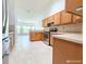 Spacious eat-in kitchen with stainless steel appliances and countertops at 3095 Coronet Ct, Spring Hill, FL 34609