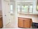 Kitchen with countertops, and a view to a bright dining area at 3095 Coronet Ct, Spring Hill, FL 34609
