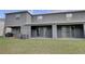 Spacious backyard features a covered patio and lush lawn, perfect for outdoor relaxation at 33062 Frosted Clover Way, Wesley Chapel, FL 33545