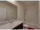 Bright bathroom features a shower and tub combo, vanity, and a large mirror at 33062 Frosted Clover Way, Wesley Chapel, FL 33545