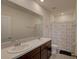 Bright bathroom with double sink vanity, tile floors, and a shower and tub combo at 33062 Frosted Clover Way, Wesley Chapel, FL 33545