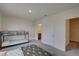 Carpeted bedroom features a bunk bed, entrance to a bathroom, and closet at 33062 Frosted Clover Way, Wesley Chapel, FL 33545