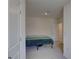 Bright bedroom view with carpeted floors and an open door to the hallway at 33062 Frosted Clover Way, Wesley Chapel, FL 33545