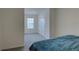 Cozy bedroom featuring carpeted floors, neutral walls and a window for natural light at 33062 Frosted Clover Way, Wesley Chapel, FL 33545