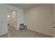 An empty room with white walls and tile floors offering a versatile space for living, dining, or creative pursuits at 33062 Frosted Clover Way, Wesley Chapel, FL 33545
