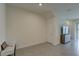 Bright living area features tiled flooring and neutral paint, ready for personalization at 33062 Frosted Clover Way, Wesley Chapel, FL 33545