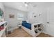 bedroom featuring a bed with built-in storage and a ceiling fan at 3418 W Bay Ave, Tampa, FL 33611