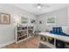 Charming bedroom with natural light, a bookshelf, and playful decor at 3418 W Bay Ave, Tampa, FL 33611
