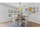 Cozy dining room with natural lighting and decorative light fixture at 3418 W Bay Ave, Tampa, FL 33611