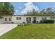 Charming single story home with well-manicured lawn and updated windows at 3418 W Bay Ave, Tampa, FL 33611