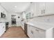 Modern kitchen featuring stainless steel appliances, white cabinetry, and subway tile at 3418 W Bay Ave, Tampa, FL 33611