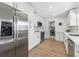 Modern kitchen featuring stainless steel appliances, white cabinetry and subway tile backsplash at 3418 W Bay Ave, Tampa, FL 33611