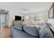 Bright living room featuring new floors, ceiling fan, and comfortable seating at 3418 W Bay Ave, Tampa, FL 33611