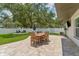 Inviting backyard patio with a dining area and seating, perfect for entertaining guests at 3418 W Bay Ave, Tampa, FL 33611