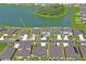Aerial view shows the backyard, landscaping, and proximity to community lake and amenities at 3611 Natural Trace St, Plant City, FL 33565