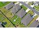 An aerial view shows a meticulously maintained yard and patio surrounded by a pristine privacy fence at 3611 Natural Trace St, Plant City, FL 33565