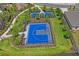 Aerial view of a well-maintained community basketball court, perfect for recreation and sports activities at 3611 Natural Trace St, Plant City, FL 33565