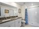 Well-lit bathroom features double sinks, granite countertops, and a tiled walk-in shower at 3611 Natural Trace St, Plant City, FL 33565