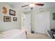 Well-lit bedroom featuring a ceiling fan, closet with double doors, and neutral decor at 3611 Natural Trace St, Plant City, FL 33565