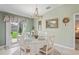 Cozy dining area features a chandelier and natural light with sliding door to the back at 3611 Natural Trace St, Plant City, FL 33565