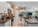 Bright kitchen features granite countertops, stainless appliances, and white cabinetry at 3611 Natural Trace St, Plant City, FL 33565