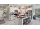 Kitchen with large island, granite counters, and modern stainless appliances. Provides seating for casual dining at 3611 Natural Trace St, Plant City, FL 33565
