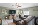 Comfortable living room with a large sectional sofa and media center at 3611 Natural Trace St, Plant City, FL 33565