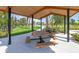 Community picnic shelter with wooden tables and benches and manicured green space for outdoor gatherings at 3611 Natural Trace St, Plant City, FL 33565