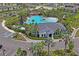 Stunning community pool with lush landscaping, a pavilion, and a splash area for residents to enjoy at 3611 Natural Trace St, Plant City, FL 33565